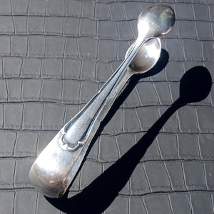 Vintage Silver plated Sugar tongs. Small Silver plated kitchen tongs. Made in the early to mid-20th century. Silver plated 90.