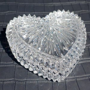 Close-up of clear cut lead crystal heart box sparkling in sunlight.