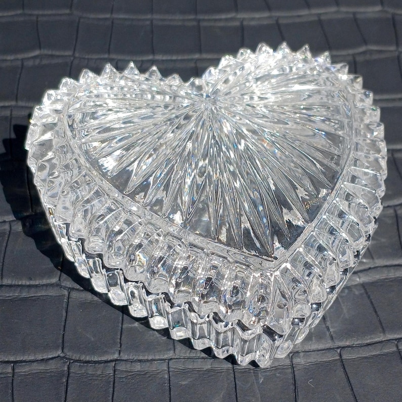 Close-up of clear cut lead crystal heart box sparkling in sunlight.