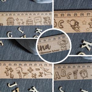 May include: Five wooden rulers with different designs. The rulers are all 30 cm long and have different designs, including a school bus, a dinosaur, an astronaut, a koala, and letters of the alphabet. The rulers are made of natural wood and have a light brown color.