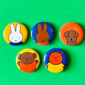 May include: A collection of five colorful round buttons featuring cartoon animal characters. The buttons include a white rabbit, a brown rabbit, a brown dog, a brown bear, and an orange pig. Each button has a different background color, including yellow, blue, and orange.