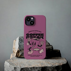 May include: A pink phone case with a cartoon coffee cup design. The design says "Coffee Break" and "Espresso Yourself Before You Depresso Yourself".
