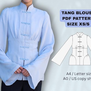 May include: Pale blue Tang blouse with a mandarin collar and frog fastenings. The blouse features long, flared sleeves and a fitted waist. The image also includes a pattern diagram and text that reads "TANG BLOUSE PDF PATTERN SIZE XS/S".