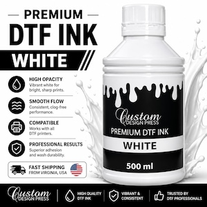May include: A 500 ml bottle of white DTF ink with a black label featuring the text Custom Design Press Premium DTF Ink White. The bottle is surrounded by a white liquid splash effect, and the packaging includes details on high opacity, smooth flow, printer compatibility, and professional results.