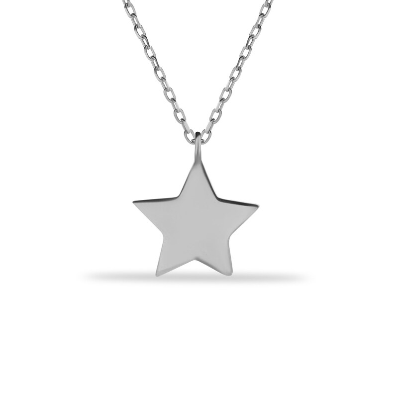 May include: A silver chain necklace with a simple star pendant.