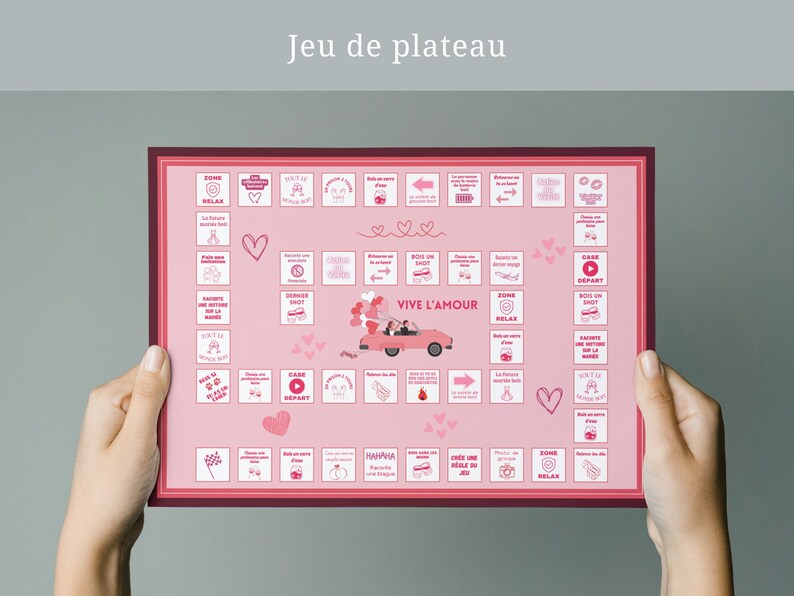 Pode incluir: Um tabuleiro de jogo rosa e vermelho com o texto "Jeu de plateau" e "VIVE L'AMOUR" em branco. O tabuleiro apresenta v&aacute;rios &iacute;cones e imagens, incluindo cora&ccedil;&otilde;es, um carro e um bot&atilde;o de reprodu&ccedil;&atilde;o.