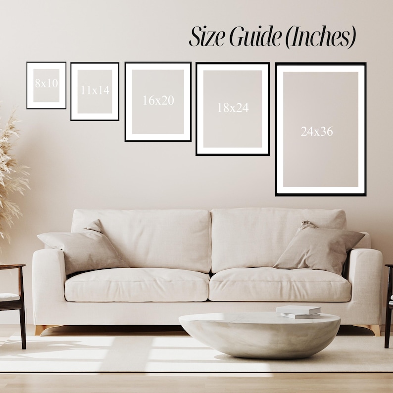 May include: A size guide in inches is displayed above a white sofa with beige cushions and a concrete coffee table. The guide shows framed art in the following sizes: 8x10, 11x14, 16x20, 18x24, and 24x36.