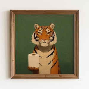 Peut inclure: Impression artistique encadrée d'un tigre tenant un rouleau de papier toilette. Le tigre est orange et noir, avec une expression sérieuse. Le fond est vert uni et le cadre est marron.