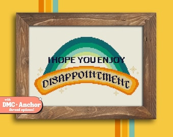 May include: Cross stitch pattern featuring a rainbow with the text "I hope you enjoy disappointment".
