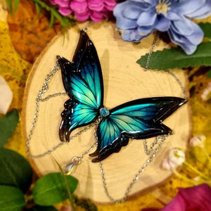 Halskette mit blauem Schmetterling