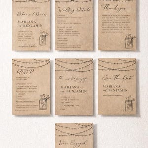 May include: A collection of rustic wedding stationery cards with string lights and a mason jar illustration. The cards include details for a rehearsal dinner, wedding details, thank you notes, RSVP, and save the date announcements.