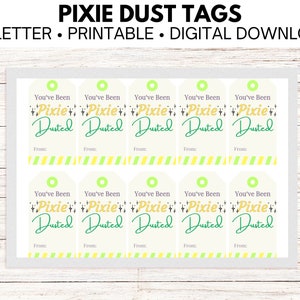 May include: Ten printable gift tags with a light green background and a white border. The tags feature the text "You've Been Pixie Dusted" in green and gold lettering with a green and gold glitter design. The tags also have a line for "From:" at the bottom.