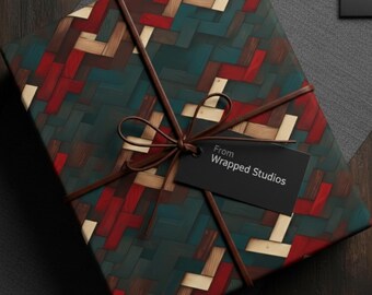 Peut inclure: Un cadeau emballé avec un motif tissé dans des tons de teal, rouge et beige. Le cadeau est noué avec de la ficelle marron et une petite étiquette noire qui dit "From Wrapped Studios". Le cadeau est sur une surface en bois foncé.