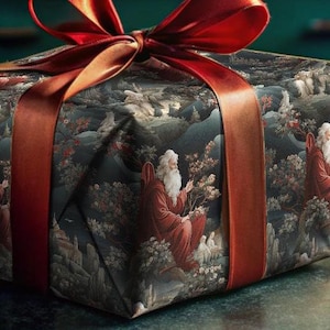 May include: A wrapped gift box with a red ribbon and a festive design. The box is sitting on a dark surface with a sprig of greenery and red berries.
