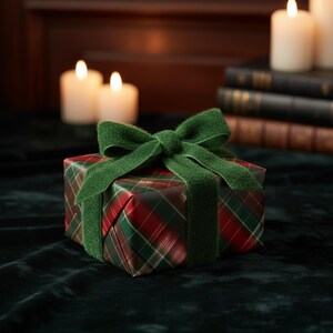 May include: A wrapped present with red and green tartan paper and a green velvet ribbon. The gift is tied with a large bow. Lit candles and books are in the background, creating a festive holiday scene.