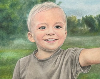 May include: A portrait of a young boy with blonde hair, wearing a grey t-shirt, smiling and looking to the right. The background is a blurred image of green trees and a blue sky.