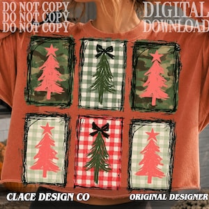 May include: A rust-colored sweatshirt featuring a graphic print of six rectangular panels. Each panel contains a stylized Christmas tree design with either a red or green color scheme, accented by buffalo plaid or camouflage patterns.