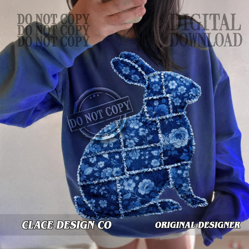May include: A blue sweatshirt with a patchwork rabbit design. The rabbit is made of blue floral fabric. The text "CLACE DESIGN CO" and "ORIGINAL DESIGNER" are visible. The words "DO NOT COPY" and "DIGITAL DOWNLOAD" are also present.