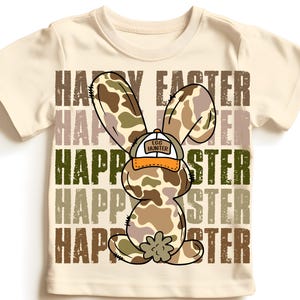 May include: A beige t-shirt featuring a camouflage bunny rabbit wearing a baseball cap that says "Egg Hunter" and the words "Happy Easter" repeated in a distressed font.