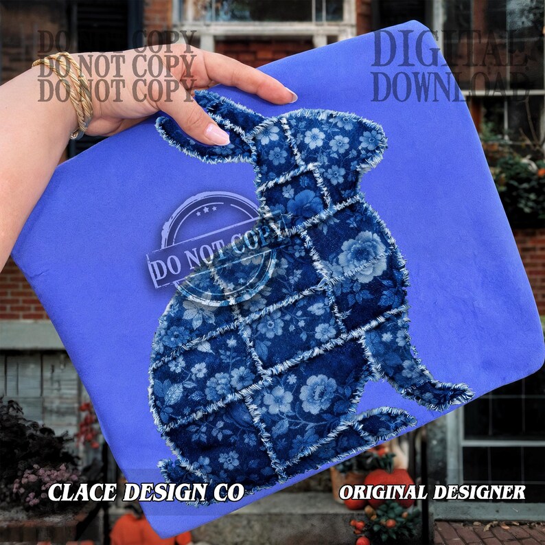 May include: A blue fabric featuring a patchwork rabbit design. The rabbit is crafted from blue floral fabric. The words "DO NOT COPY" and "DIGITAL DOWNLOAD" are visible. The text "CLACE DESIGN CO" and "ORIGINAL DESIGNER" are also visible.
