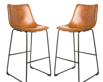 May include: Two brown faux leather bar stools with black metal frames. The stools have a simple, modern design and are perfect for a kitchen island or bar.