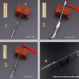 May include: Four miniature decorative spears, each approximately 8.6 inches long. The spears feature various designs, including a silver blade with a brown handle, a blue and silver spear with a dragon design, a gold spear with a red tassel, and a purple spear.