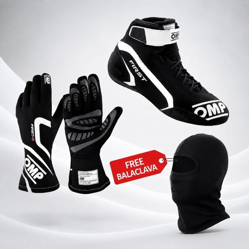 May include: A black and white OMP racing shoe, a pair of black and white OMP racing gloves with grey palm detailing, and a black balaclava. A red rectangular tag is attached to the balaclava with the white text FREE BALACLAVA printed on it.