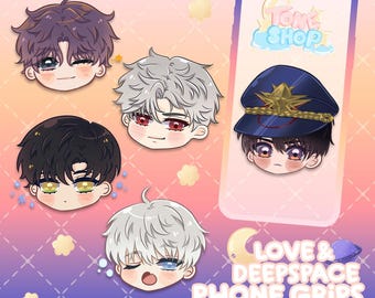 May include: A collection of epoxy resin phone grips featuring anime-style character designs. The grips showcase various male characters with different hair colors and expressions. One grip features a character in a navy blue police hat. The phone screen displays the text "TONE SHOP".