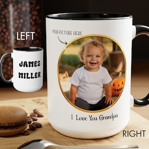 May include: A white ceramic mug with a black handle and interior. The left side displays the name James Miller in black text. The right side features a circular gold-framed photo of a child, the text Your Picture Here, and I Love You Grandpa.