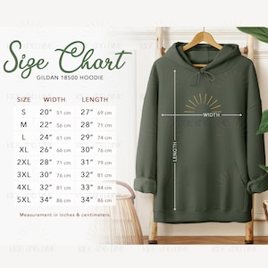 May include: An olive green Gildan 18500 hoodie displayed on a wooden hanger. The image includes a size chart with measurements in inches and centimeters. The chart lists sizes S through 5XL, with corresponding width and length measurements.