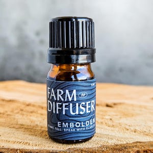 May include: A set of three ceramic mugs with a speckled, matte finish. The mugs are in shades of cream, light gray, and dark gray. Each mug has a simple, minimalist design, perfect for coffee or tea.