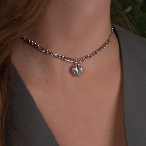 Small Heart Necklace. Unique silver choker necklace made with stainless steel figaro chain and a dainty heart charm. This minimalist style choker- necklace is comfortable to wear every day in every occasion. Its length is 32cm plus 10cm extension.