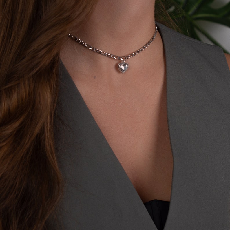Small Heart Necklace. Unique silver choker necklace made with stainless steel figaro chain and a dainty heart charm. This minimalist style choker- necklace is comfortable to wear every day in every occasion. Its length is 32cm plus 10cm extension.