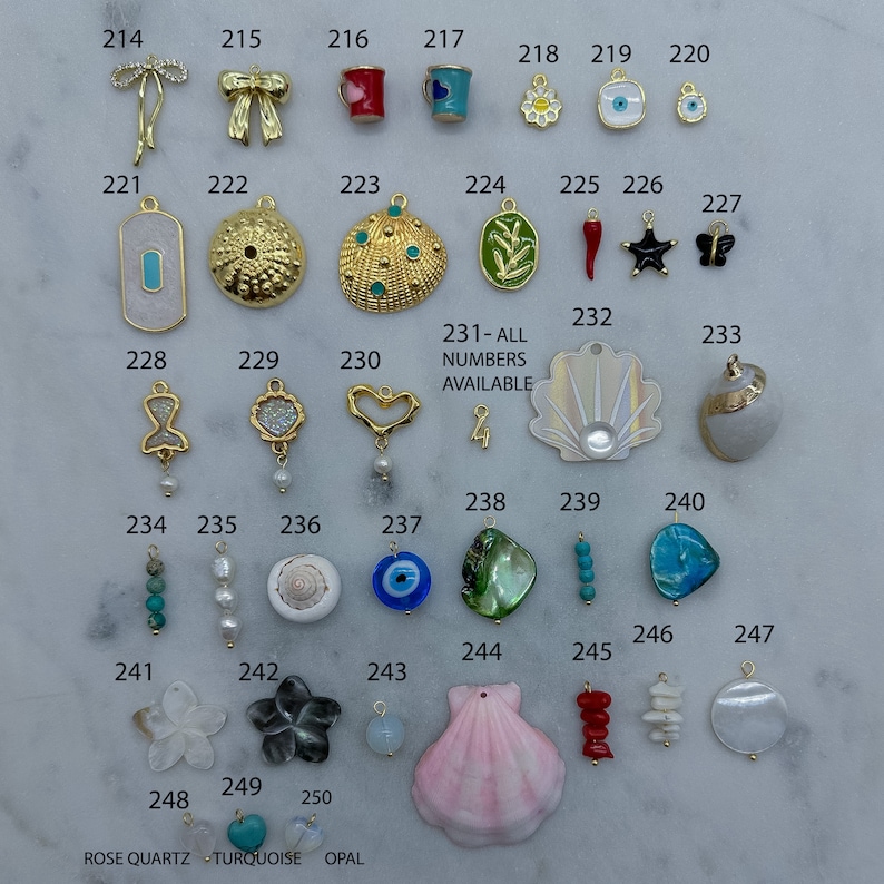 May include: Assortment of colourful charms for jewellery making, including seashells, butterflies, stars, flowers, and more. 231-ALL NUMBERS AVAILABLE.