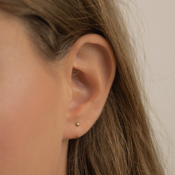 Hoop earrings with store bar across