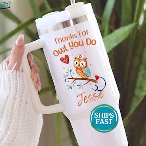 May include: White insulated tumbler with a handle, featuring an owl wearing a nurse's cap and a stethoscope. The text "Thanks For Owl You Do" and the name "Jesse" are printed on the tumbler. A heart graphic is also included.