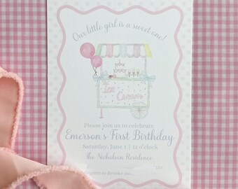 May include: A pink and white invitation card with the text "Our little girl is a sweet one!" and "Emerson's First Birthday." The card features an illustration of an ice cream cart with balloons and a cake.