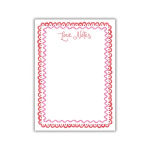 May include: A white card with a pink and red scalloped border. The text "Love Notes" is written in pink cursive at the top of the card.