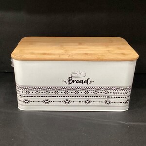 Front view of the white bread box featuring black geometric patterns and the word Bread with a loaf icon.