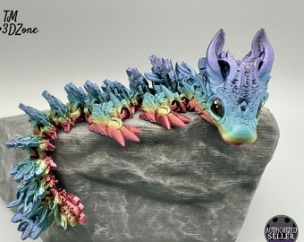 Baby Lunar Dragon Rainbow, posable 3d printed baby moon dragon in rainbow colors and with hand-painted eyes
