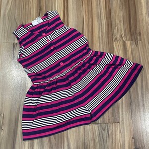 May include: Sleeveless dress with horizontal stripes in fuchsia, navy blue, and white. The dress features a button-up front and a gathered waistline. The garment is made of a lightweight fabric.
