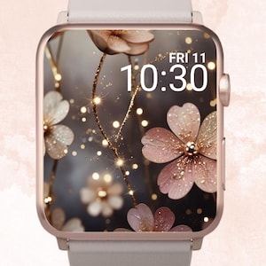 Peut inclure: Une montre connectée rose gold avec un bracelet blanc et un cadran floral. Le cadran de la montre présente des fleurs roses avec des accents de paillettes dorées et une horloge numérique affichant "FRI 11 10:30".