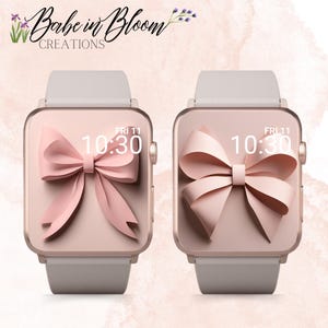 Op de afbeelding: Twee roségouden Apple Watch-wijzerplaten met een roze strikdesign en de tijd weergegeven als 10:30. De tekst "FRI 11" wordt ook op elke wijzerplaat weergegeven.