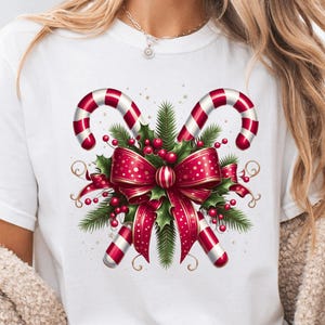Camiseta navideña con bastón de caramelo, colores cómodos, regalo para Navidad, camiseta con lazo, linda camiseta navideña de invierno con lazo coqueto de muérdago, club navideño.