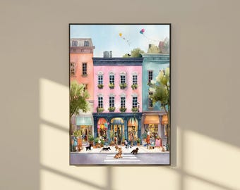 May include: Watercolor painting of a street scene with colorful buildings, shops, and people. The buildings are pink, blue, and peach. Several dogs are in the street. A crosswalk is visible. Balloons float in the sky. The artwork is framed in black.