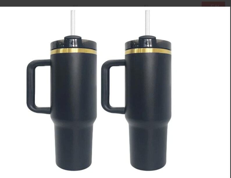 May include: Two black stainless steel travel mugs with gold accents and lids. Each mug has a handle and a clear straw.