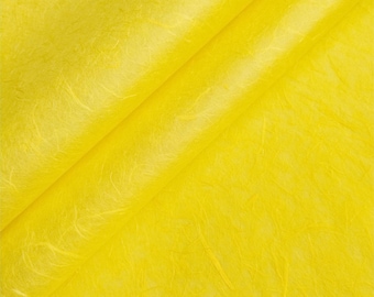 May include: A close-up of a yellow textured paper. The paper has a subtle sheen and a slightly crinkled appearance.