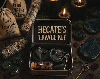 May include: A Hecate's Travel Kit with a black tin, containing a pendulum, a small glass bottle, and a key. The kit is surrounded by candles, sage bundles, and small bags with text. The text on the tin reads "HECATE'S TRAVEL KIT".