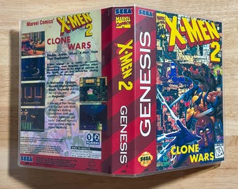 May include: A Sega Genesis video game case for X-Men 2 Clone Wars. The front cover features Marvel characters including Wolverine and Magneto. The back cover displays game screenshots, descriptive text, and a Kids to Adults rating icon.