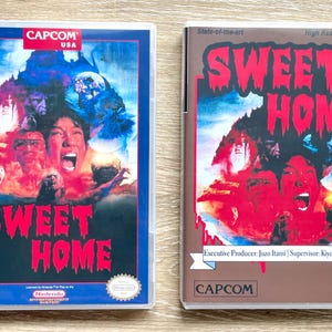 May include: Two rectangular video game cases for Sweet Home. The left case has a blue border, Capcom USA logo, and horror-themed artwork. The right case has a brown border, Capcom logo, and text including Executive Producer: Juzo Itami.